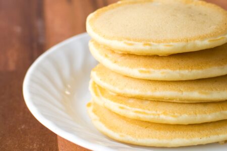 Fluffy Dairy-Free Pancakes Recipe with Tips and Options for All! Made simply with oil and water. No butter or milk of any kind needed!